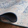 Layla rug folded back to reveal low pile thickness and dense polyester weave texture