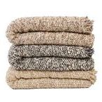Stack of Brentwood Throws in different colors including beige, gray, and tan folded neatly