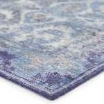 Hand-knotted vintage style rug with deep blue, denim, and gray hues and an elegant center medallion design.