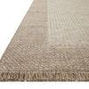 Close-up angled view showing textured woven border and fringe detail