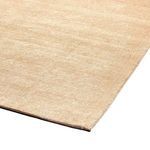 Angled corner view showing rug thickness and tightly woven edge finishing