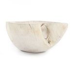 Diagonal side angle capturing the depth and irregular rim profile of the wooden bowl