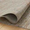 Curled corner of Sunrise rug revealing soft pile and tightly woven back texture on hardwood floor