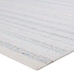 Close-up angle showing the rug’s woven texture and detailed airy lines with subtle color specks