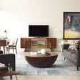 Coffee table featured in living room with grey sofa, wooden side table, and muted decor in neutral tones