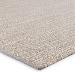 Close-up of the rug’s woven texture showing tight, flat weave and subtle color variations