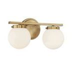 Side angle view showing the depth and rounded globes of Jenni 2 Light Bath Bar in brass finish