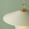 Side angle emphasizing smooth texture of cream shade and chain attachment detail