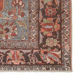 Detailed close-up of rug border highlighting intricate pattern and color contrast