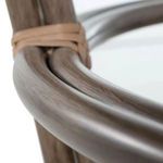 Close-up highlighting rounded corner of oak armrest with wicker wrapped joints
