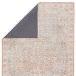 Back corner of Fay Medallion rug folded to reveal dark gray rug backing