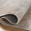 Curled edge of Townes Beige Clay Rug revealing fabric layering and texture