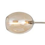 Close-up of a single elongated champagne glass globe with a lit filament bulb inside