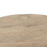 Detailed close-up of table top surface revealing rustic oak grain and small dark markings
