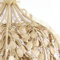 Top view focusing on the pendant’s rounded metal crown and upper curved arms holding the petals