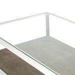 Partial side view focusing on the smooth glass surface and textured faux shagreen base underneath