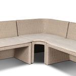 Front row seating detail showing cushion seams and rattan base of adjoining sections