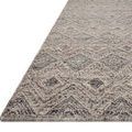 Side angle view showing thickness and texture of handwoven wool and cotton geometric rug