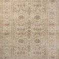 Heritage ivory and natural traditional rug with vintage-inspired faded floral motifs and variable-pile texture