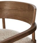 Close view of curved oak backrest and wrapping arm rail highlighting woodworking details