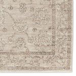 Close-up of Camille rug’s floral border pattern with subtle color shading and distressed look