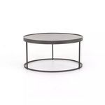 Close-up detail of matte black iron frame leg and supporting rim