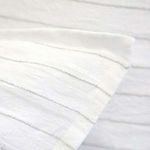 Close-up of Blake White/Ocean Duvet corner showing fine interwoven stripe detail