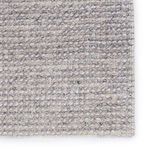 Close-up of corner showing woven yarn detail with gray and ivory tones