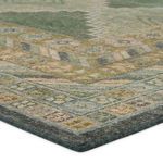 Low angled close-up showing detailed texture and distressed wool fibers of the rug’s border