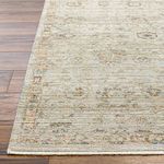 Close-up of Ren Taupe/Charcoal rug corner highlighting flat weave texture and floral border