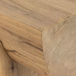 Close-up of corner detail where beam-like tabletop meets pedestal base