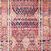 runner version of the rug featuring vertical geometric patterns in magenta and gold with distressed detailing
