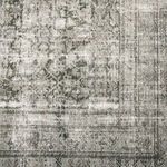 Close-up showing distressed texture and detailed vintage floral motifs with sage and olive accents
