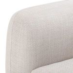 Close-up capturing fabric and stitch detail along vertical armrest edge