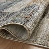 Rug rolled up partially showing soft textured pile and backside weave