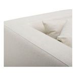 Close-up of sofa armrest and pillows showing fabric texture and smooth upholstery lines