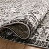 Folded corner revealing soft texture and flexibility of the Odette Charcoal and Silver traditional rug