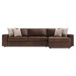 Front view of the Nest sectional showing smooth leather cushions and symmetrical throw pillows