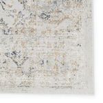 Detailed shot of rug border highlighting floral trellis pattern and tonal color variations