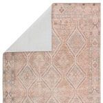 Close-up of Marquesa rug corner showing the delicate worn effects and variegated color blending.