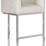 Side angle view showing stool’s chrome legs and curved barrel base with textured light fabric upholstery