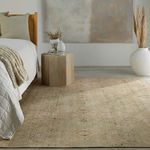 Rug styled in a minimalist bedroom with wooden furniture and abstract wall art