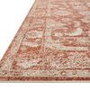Low angle close-up of rug corner showing detailed border pattern and flat pile texture