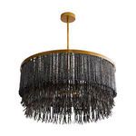 Chandelier shot from below emphasizing round shape and draping wood beads with hanging shell talons