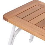 Angled close-up of corner joint between wooden top and matte ivory metal frame