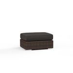 Montecito Ottoman with rich Cognac multi-colored resin wicker base and dark cushion for outdoor use