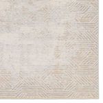 detailed view of tan and gray geometric pattern on rug with high-low pile contrast