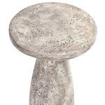 Top-down view showing round textured tabletop with speckled concrete finish
