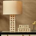 Aarna box set displayed on black console table next to matching lamp and gold fish sculpture