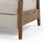 Close view of wood base and lower upholstery seam of Noble Platinum recliner